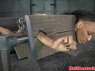 Bound Ebony Sub In Pillory Gets Spanked And Choked