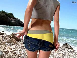 pornstar brunette mya lorenn dancing and stripping on the beach