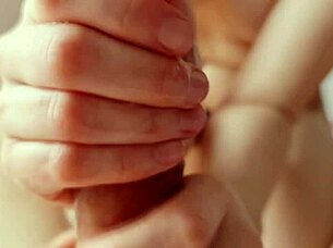 she gives an intense handjob while showing her nice tits, leading to a big cumshot.