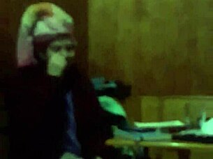 The 18-year-old girl with wet pink hair participates in a wet scene.