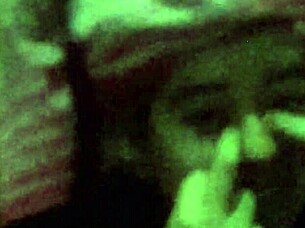 The 18-year-old girl with wet pink hair participates in a wet scene.