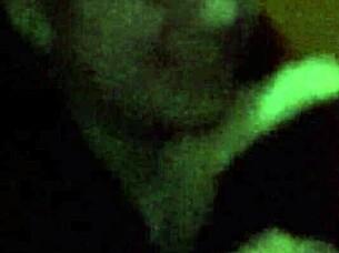 The 18-year-old girl with wet pink hair participates in a wet scene.