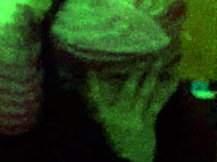 The 18-year-old girl with wet pink hair participates in a wet scene.