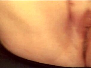 Glass dildo used in maledom scene with legs