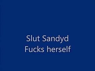 Glass dildo used in maledom scene with legs