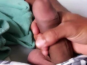 A guy jerks off his big monster cock