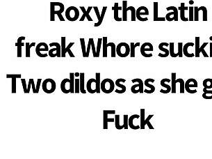 Slutty Roxy Sucks Two Dildos While Getting Fucked Doggy Style.