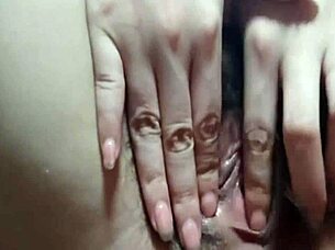 Asian girl masturbates with vibrator, her wet pussy opening like a little mouth