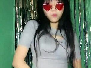 Korean Asian girl performs sexy dance on Uplive livestream webcam show.