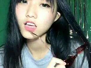 Korean Asian girl performs sexy dance on Uplive livestream webcam show.