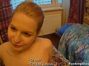 Christina teen in glasses has fun with persimmon