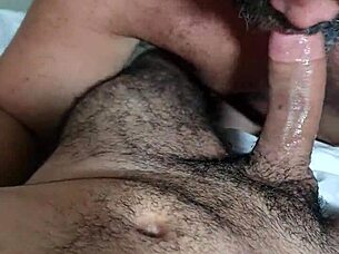 i'm enjoying sucking on this hairy guy's big cock in a gay encounter.