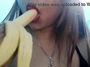 seductive girl plays with banana