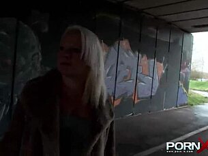 Is this mature blonde babe flashing her tits and pissing on the street in public?