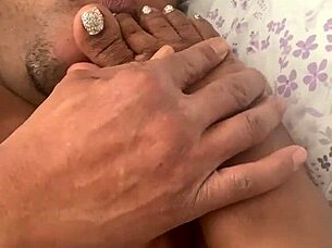 wife sucks toes while giving handjob
