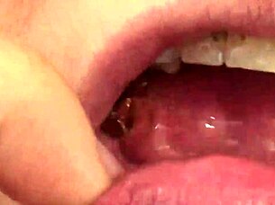 Close up of Fifi Foxx eating gummy bears in mouth vore