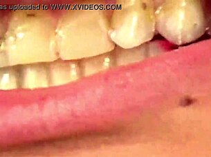 Close up of Fifi Foxx eating gummy bears in mouth vore