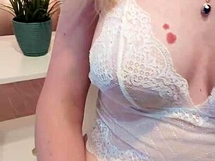 beauty in stockings fingers her pussy and orgasms loudly