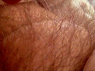 horny milf rubs hairy pussy at home