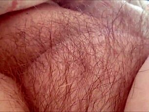 horny milf rubs hairy pussy at home