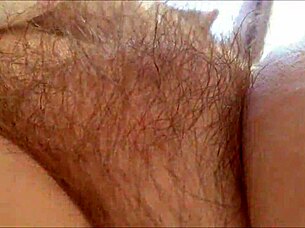 horny milf rubs hairy pussy at home