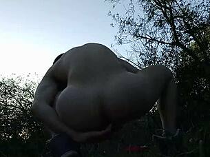 A latino guy masturbates his big cock in the forest before getting caught