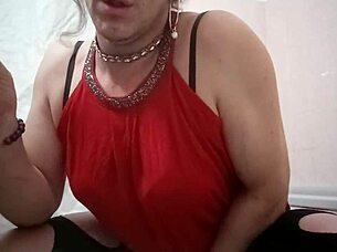 A travesti plays with a gode in her bedroom