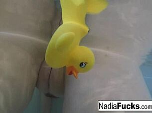 Nadia Strips Naked, Rubs Pussy With Rubber Toys