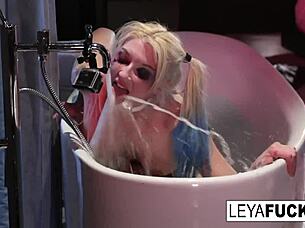 Leya Falcon enjoys a shower, using the tub head on her ass.