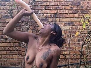 indian babe deepthroats dildo and gags in garden