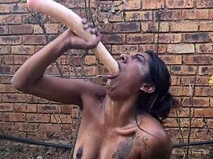 indian babe deepthroats dildo and gags in garden
