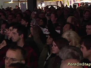 Lesbian sex show on public stage with striptease