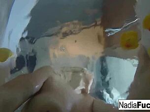 sexy nadia bathes with rubber duckies in solo fun