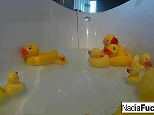 sexy nadia bathes with rubber duckies in solo fun