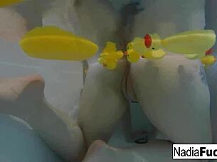 sexy nadia bathes with rubber duckies in solo fun