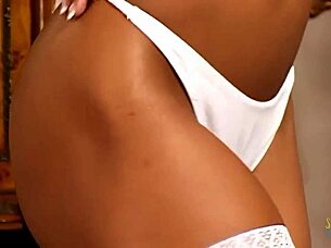 Ebony teen in lingerie sucks big black cock then rides it on the sofa for facial