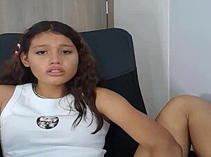 Eighteen-year-old woman plays with pussy using dildo