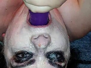 Ms TL takes dildo deep in throat.