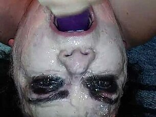 Ms TL takes dildo deep in throat.