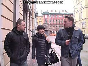 Hot amateur brunette engages in threesome with two tattooed studs for cash