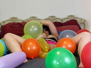 a story of balloon popping during a barefoot session with toys and vibrator.