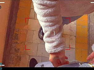 Stepbrother and stepsister assist each other outdoors in public setting