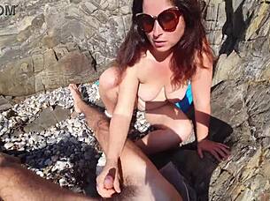 Exhibitionist Flashes Dick to Nudist Milf Who Sucks Him on Beach