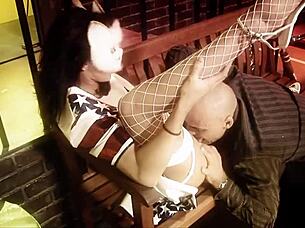 A naughty brunette in a kitty mask awaits her facial eagerly.