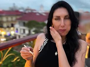 In a bustling restaurant, a girl performs a blowjob on her partner discreetly.