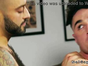 Tattooed muscular hunk intensely fucks pal's ass bareback.