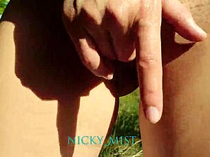 Stepsister masturbates outdoors.