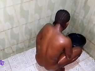 African teen enjoys a relaxing homemade bath in Naija family official video