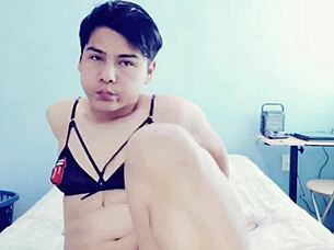 young hot gay guy touches himself in his room, exploring crossdressing fantasies