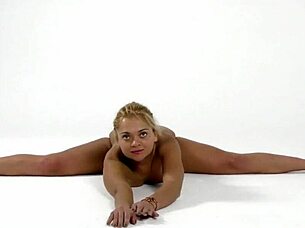 Blonde teen gymnast flaunts flexy moves in dress